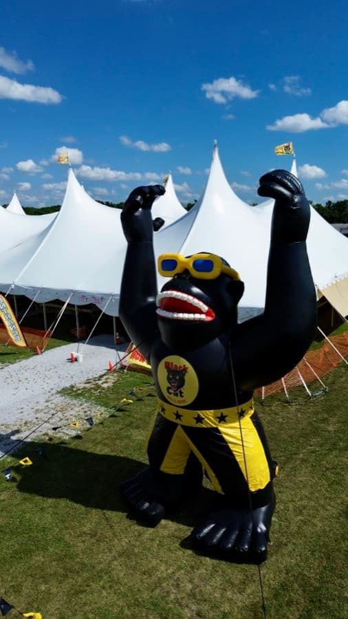 Aerial drone view of the giant inflatable Joerilla mascot in front of the multi-tent Crazy Joe's Fireworks stand at 171st and Holmes, Kansas City