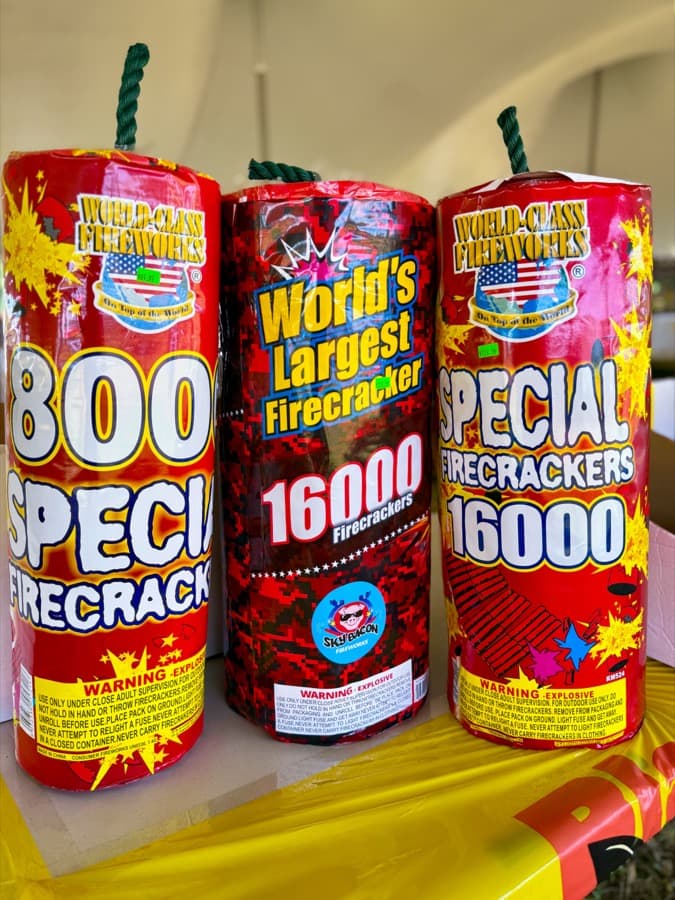 Three World Class "World's Largest Firecracker" 16,000-pack canisters on the shelves at Crazy Joe's — the biggest firecracker rolls money can buy